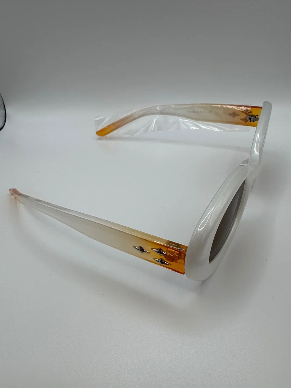 White Oval Sunglasses with Brown Lenses